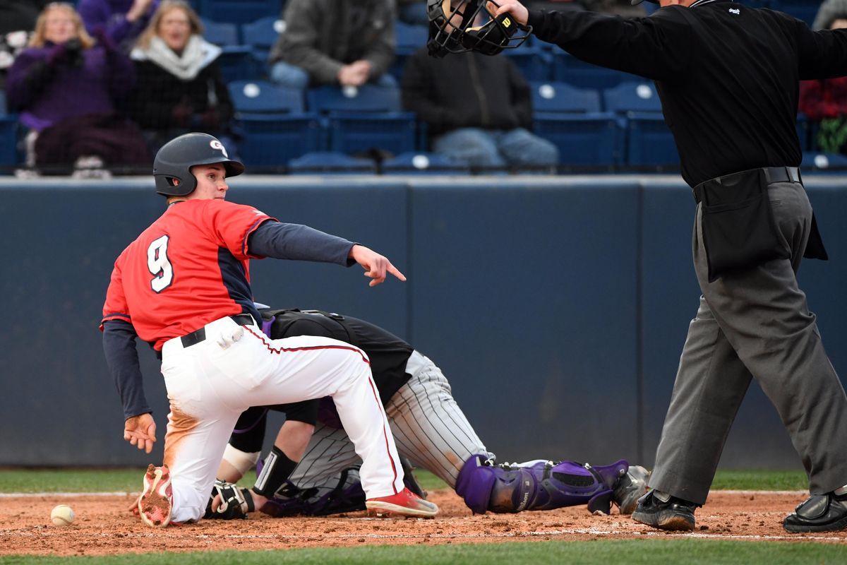 Gonzaga’s Carson Breshears  is called safe at home  as the ball gets away from Portland catcher Tate Budnick on Friday. (Jesse Tinsley / The Spokesman-Review)