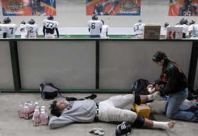 
Workhorse running back Alex Shaw of Lewis and Clark, the GSL's leading rusher, gets taped prior to Tuesday's practice. 
 (J. Bart Rayniak photos / The Spokesman-Review)