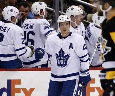 Toronto Maple Leafs’ Tyler Bozak (42) celebrates as he returns to the bench after scoring his second goal of the game in the second period of an NHL hockey game against the Pittsburgh Penguins in Pittsburgh, Saturday, Dec. 9, 2017. (Gene J. Puskar / Associated Press)