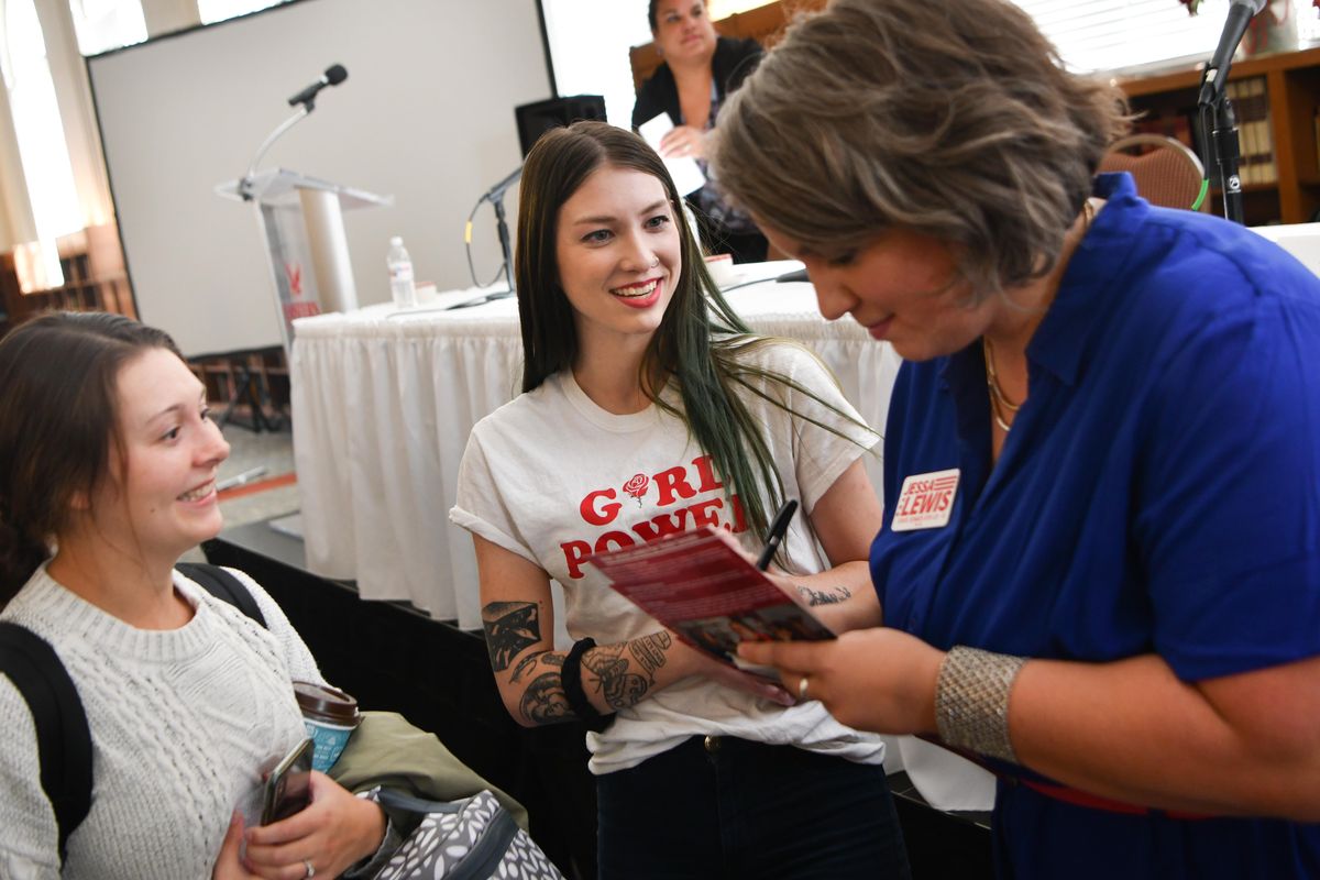 Jessica Kinney, left, and Ashley Bergman, who are both working on masters degrees in social work at EWU, chat and exchange phone numbers with Jessa Lewis  who is running for Washington’s 6th Legislative District Senate seat after EWU’s 6th Legislative District Candidate Forum on Wednesday, Oct. 3, 2018, at EWU’s Hargreaves Hall Reading Room in Cheney, Wash. (Tyler Tjomsland / The Spokesman-Review)