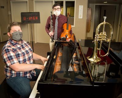 University High School choir and guitar teacher Matt Johnson, left, and instrumental music teacher Garrett Newbill are among teachers navigating the challenges of teaching a particularly difficult subject to instruct via virtual learning for the first time.  (Libby Kamrowski/ THE SPOKESMAN-REVIEW)