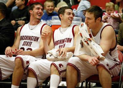 
From left, Cougars Daven Harmeling, Taylor Rochestie and Aron Baynes laugh as all enjoyed double-figures scoring. Associated Press
 (Associated Press / The Spokesman-Review)