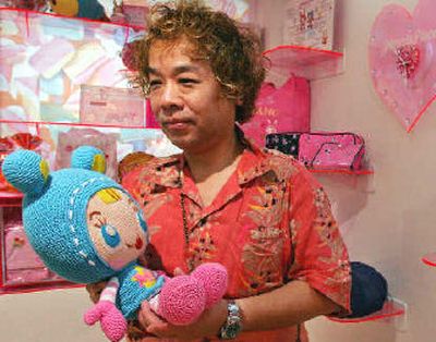 
Nobuyoshi Kurita, a sociology professor at Musashi University in Tokyo, holds a cutie doll at one of popular cute goods stores he often visits in Tokyo. 
 (Associated Press / The Spokesman-Review)
