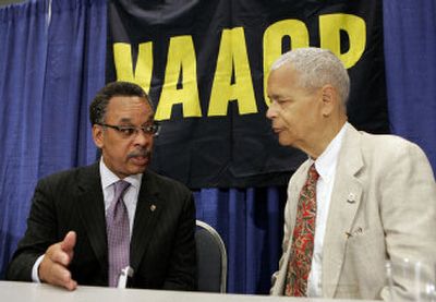 
Bruce Gordon, left, president of the NAACP, talks with NAACP Chairman Julian Bond after a news conference Saturday in Washington  as the organization's 97th annual convention begins. 
 (Associated Press / The Spokesman-Review)