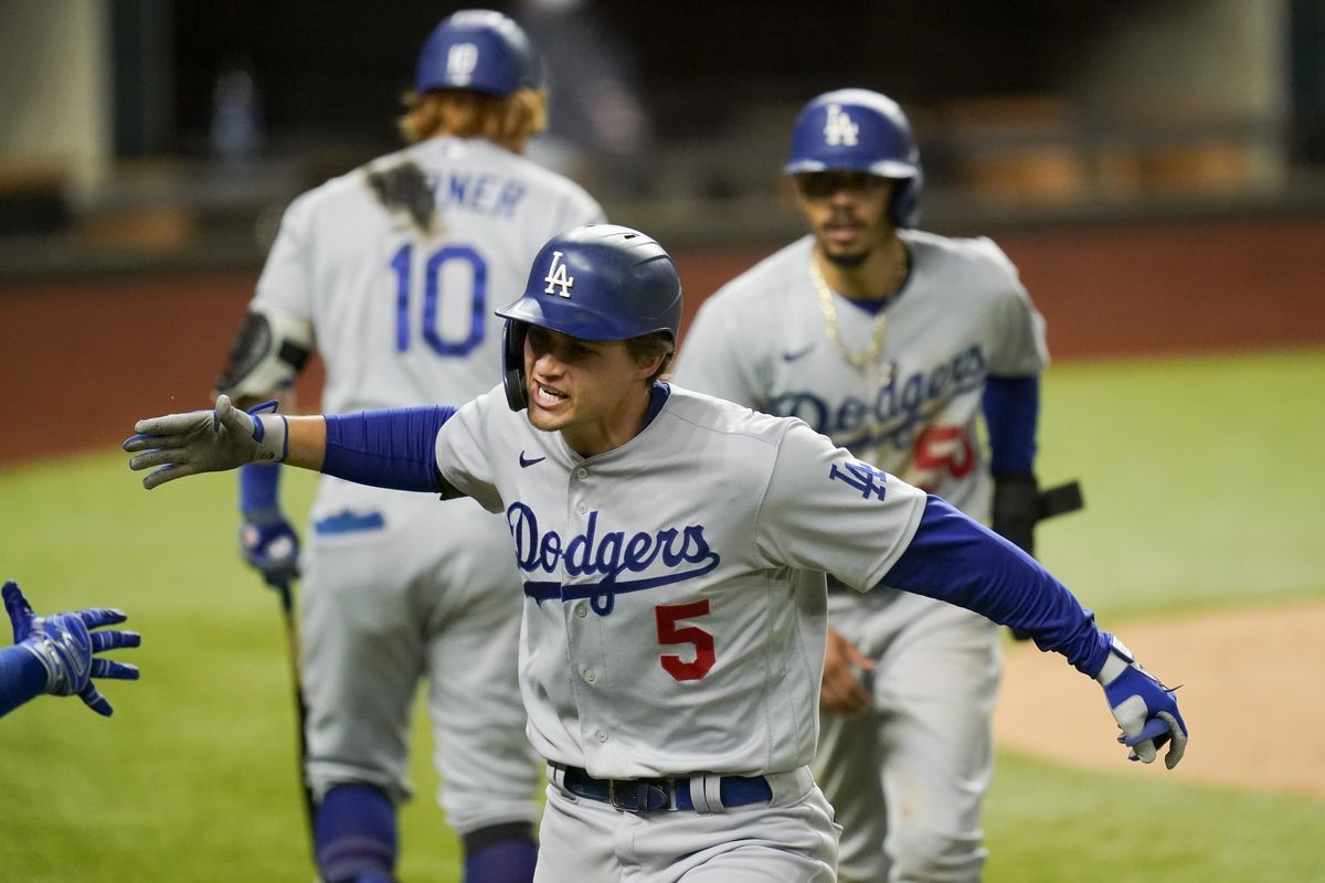 Los Angeles Dodgers’ Corey Seager celebrates his two-run home run against the Atlanta Braves during the seventh inning Friday in Game 5 in Arlington, Texas.  (Associated Press)