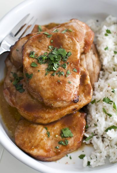 These sticky-sweet-savory marinated pork chops are easy to make on a weeknight. (Associated Press)