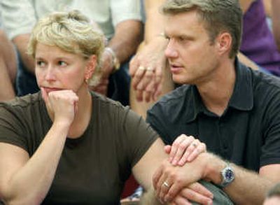 
Kristi and Mark Osterlund listen to officials discuss the Ford fire on Monday in Lockwood, Mont. The family owns a home in the area. Associated Press
 (Associated Press / The Spokesman-Review)
