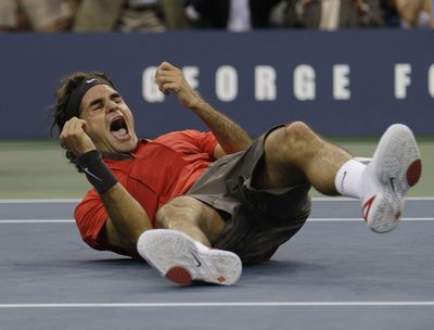Roger Federer of Switzerland celebrates after defeating Andy Murray of Britain for his only Grand Slam title of 2008. (Associated Press / The Spokesman-Review)