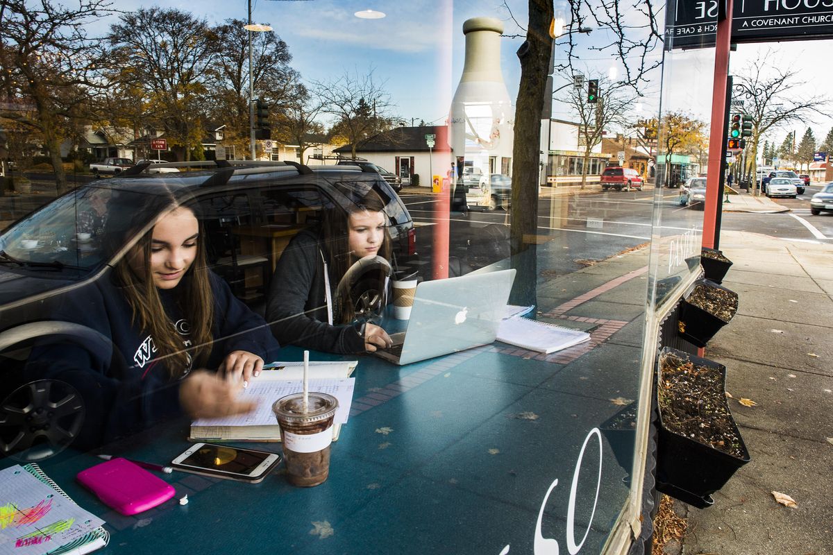 Anila Curry, left, and Mallory Cutler do homework inside The Gathering House Cafe at 733 W. Garland Ave., on Wednesday, Nov. 1, 2017. If the city tries reproduce its investment strategy on East Sprague in other parts of Spokane, several neighborhoods might be good candidates. They include places such as West Central’s West Broadway Avenue, which was nearly selected for the first project; the Garland District, which has a well-established core already; or a much smaller area like Fifth Street in East Central. (Colin Mulvany / The Spokesman-Review)
