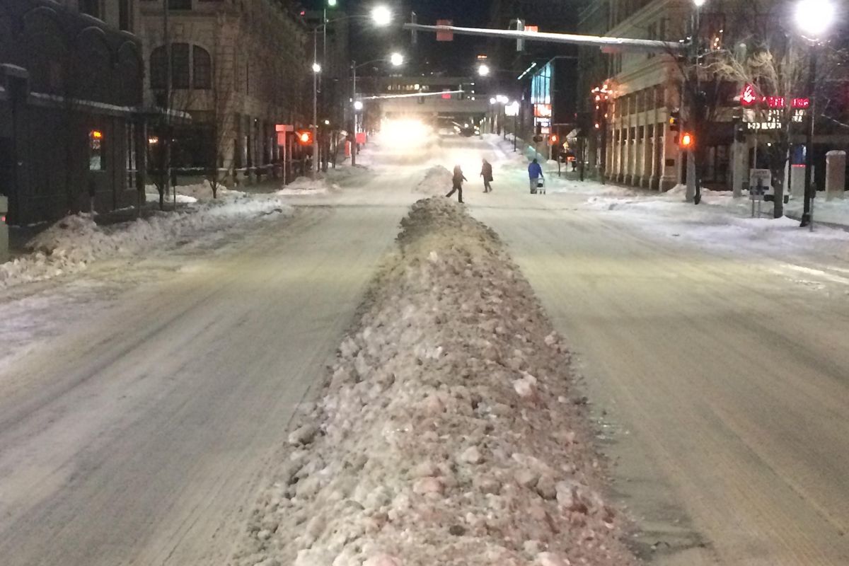 Downtown Spokane was plowed Tuesday night and early Wednesday morning two days after six inches of snow fell on the city. The plowing creating snow berms in the middle of downtown streets. (Jonathan Brunt / The Spokesman-Review)