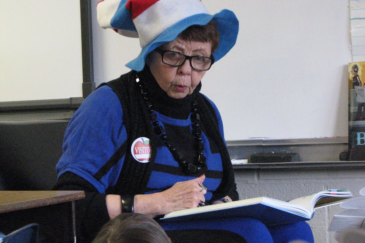 With a Cat in the Hat hat on her head, Rotarian Kay Bryant reads from a Dr. Seuss book to first-graders at Ness Elementary School in Spokane Valley. The annual reading was a celebration of Dr. Seuss’ birthday.