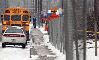 
Vista Road outside West Valley High School is in a state of congestion since construction crews and materials have filled most of the parking areas on school property.
 (Christopher Anderson / The Spokesman-Review)
