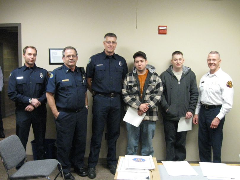 Two men were recently recognized for their livesaving efforts by the Spokane Valley Fire Department. They are pictured here along with the Engine 7 crew that responded to the call. Pictured from left to right are Firefighter Holin Honeyfield, Cpt. Tim Cruger, Paramedic Rich Bruce, Steve Stermer, Heith Carlton and Fire Chief Mike Thompson. (Photo courtesy Spokane Valley Fire Department)