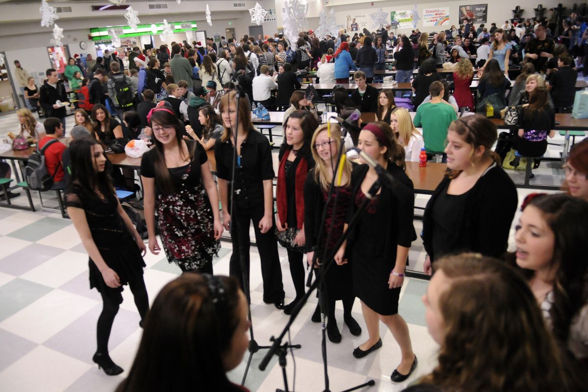 Members of the East Valley Select Choir entertain students, district administrators, board members and parents Dec. 21 during the annual holiday luncheon at the school. (J. Bart Rayniak)