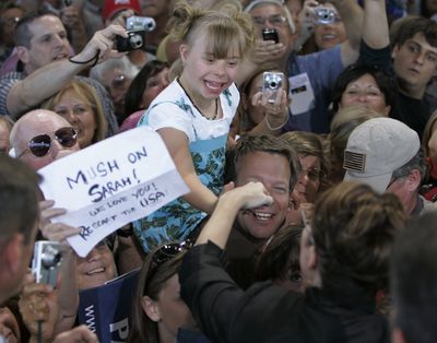 Gov. Sarah Palin reaches out to shakes hands with a girl after speaking at a campaign rally Saturday in Carson City, Nev. (Associated Press / The Spokesman-Review)