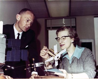 Nancy Grace Roman, NASA's first chief astronomer, explains the Advanced Orbiting Solar Observatory to astronaut Buzz Aldrin in 1965. (NASA / NASA)