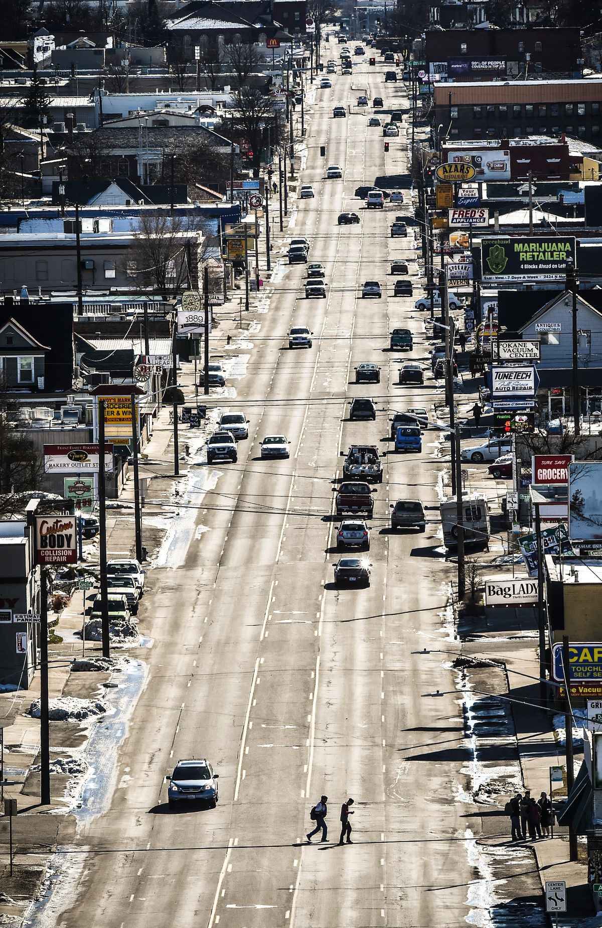 A view of North Monroe Street before the city renovated it, reducing the number of vehicle lanes and increasing pedestrian infrastructure. (Colin Mulvany / The Spokesman-Review)