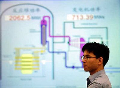 
A worker stands in front of a control monitor at the Qinshan No. 2 Nuclear Power Plant, China's first nuclear power plant. 
 (Associated Press / The Spokesman-Review)