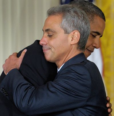 President Barack Obama hugs outgoing White House chief of staff Rahm Emanuel  at the White House on Friday.  (Associated Press)