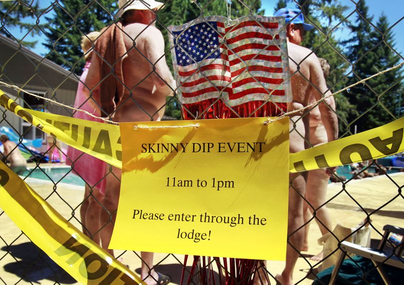 **EDS NOTE: NUDITY** A sign encourages participants to go around to the main entrance so they can be counted as The Willamettans Family Nudist Resort adds their numbers in hopes of beating last year's record in the Guinness-sanctioned �Largest Skinny Dip Across North America