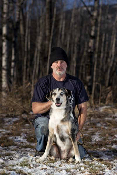 Robert MacDonald of Spirit Lake is pictured with his dog, Molly. MacDonald recently received support from Better Together Animal Alliance, previously called Panhandle Animal Shelter. Molly got a deep cut in her hind end, and MacDonald couldn’t afford a $600 veterinary bill. He got in touch with BTAA’s helpline, and the agency helped with a portion of the cost until he could pay.  (Angela Schneider/Big White Dog Photography)