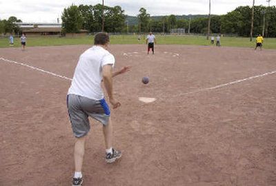 
Two teams in Syracuse, N.Y., compete in a kickball game.
 (Associated Press / The Spokesman-Review)
