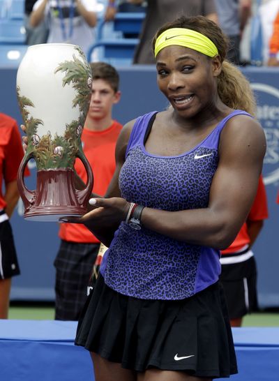 Serena Williams poses with the championship trophy after defeating Ana Ivanovic at the Western & Southern Open. (Associated Press)