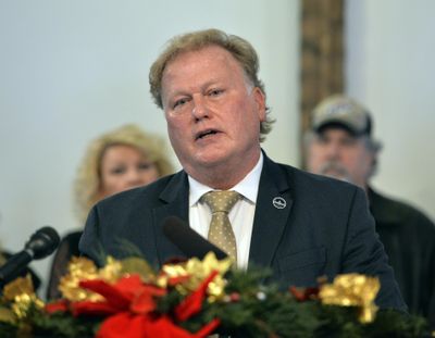 With friends and family standing behind him, Kentucky State Rep., Republican Dan Johnson addresses the public from his church on Tuesday, Dec. 12, 2017, regarding allegations that he sexually abused a teenager after a New Year's party in 2013, in Louisville, Ky. (Timothy D. Easley / Associated Press)