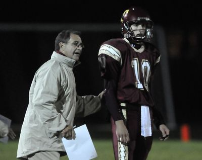 University High School coach Bill Diedrick, left, talks with his quarterback, Tony Tabish during a break in the game  Oct. 2 at University High School. Tabish is close to breaking some passing records at the school. (Jesse Tinsley / The Spokesman-Review)