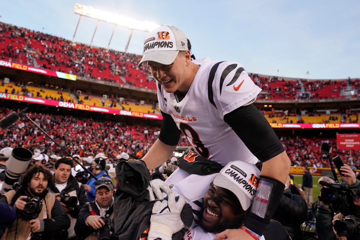 Cincinnati Bengals quarterback Joe Burrow (9) celebrates with teammate Tyler Shelvin at the end of the AFC championship NFL football game against the Kansas City Chiefs, Sunday, Jan. 30, 2022, in Kansas City, Mo. The Bengals won 27-24 in overtime.  (Associated Press)
