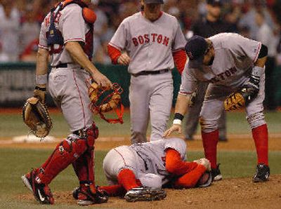 
Red Sox players gather around pitcher Matt Clement after he was hit in the head. 
 (Associated Press / The Spokesman-Review)