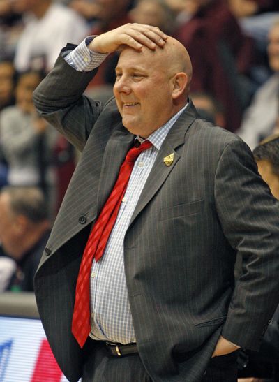 Eastern Washington head coach Jim Hayford did a little light reading before taking his team to the high altitude at Northern Arizona. (Michael Albans / Associated Press)