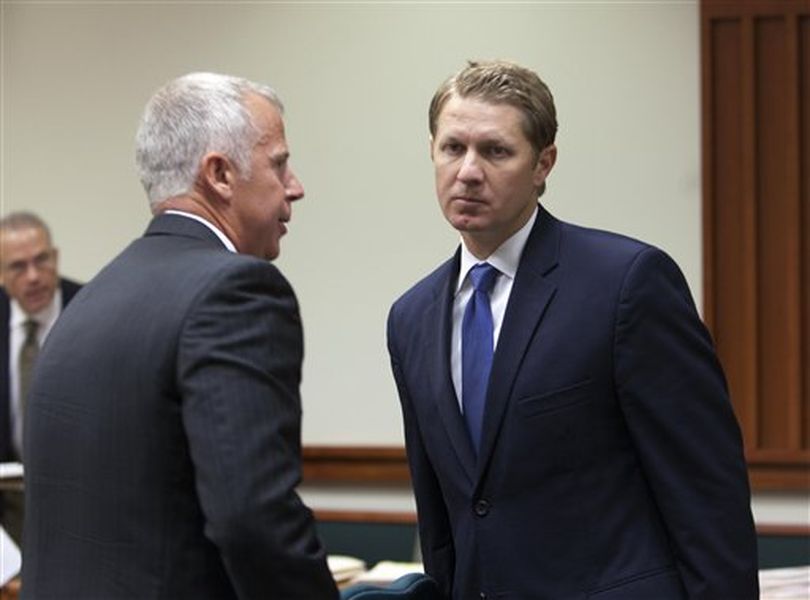 Sen. John McGee, right, leaves the courtroom on Friday, July 1, 2011, with his attorney, Scott McKay, left, after pleading guilty to driving under the influence of alcohol in a plea agreement in Boise, Idaho. Idaho Republican Sen. John McGee choked back tears after pleading guilty Friday to driving under the influence of alcohol, part of a plea agreement that came as his lawyers blamed his erratic behavior on a concussion they say impaired his judgment.  (AP Photo/The Idaho Statesman / Katherine Jones)
