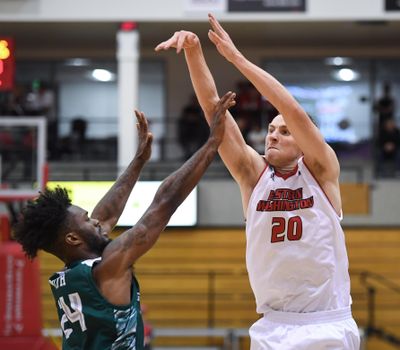 Eastern Washington guard Cody Benzel fires up a 3-pointer over Wisconsin Green Bay guard Jevon Smith  on Nov. 16  in Cheney. (Dan Pelle / The Spokesman-Review)
