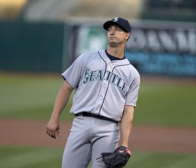 Seattle Mariners starting pitcher Joe Wieland reacts after yielding a two-run home to Oakland’s Khris Davis during the first inning  Friday. (D. ROSS CAMERON / Associated Press)