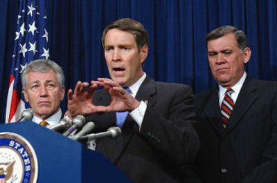 
Senate Majority Leader Bill Frist of Tennessee, flanked by Sen. Chuck Hagel, R-Neb., left, and Sen. Mel Martinez, R-Fla., meets the press Friday after the Senate failed to agree on an immigration bill. 
 (Associated Press / The Spokesman-Review)