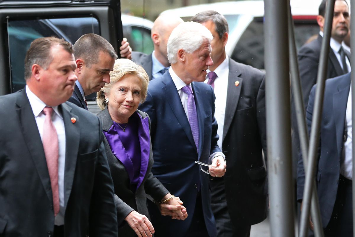 Hillary Clinton, holding hands with her husband, former President Bill Clinton, arrives at a New York hotel to speak to her staff and supporters after losing the race for the White House, Wednesday, Nov. 9, 2016. Earlier in the day she conceded the race to Republican president-elect Donald Trump. (Seth Wenig / Associated Press)