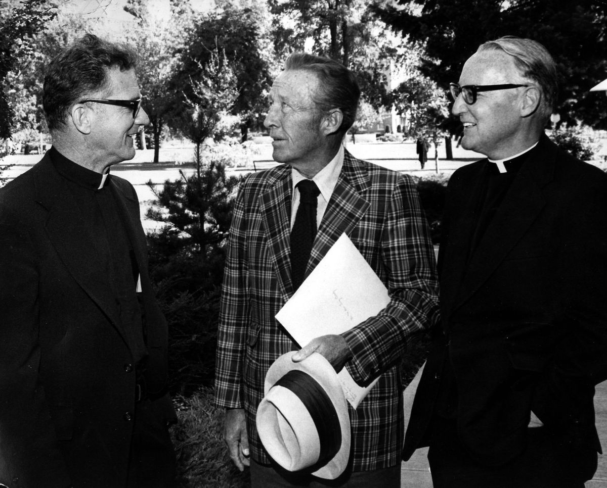 Bing Crosby visits with the Rev. Bernard Coughlin, left, of St. Louis, Mo., and the Rev. Richard E. Twohy. Coughlin succeeded Twohy as president in October 1974.