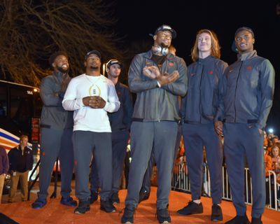 Clemson’s Christian Wilkins, Adam Choice, Hunter Renfrow, Clelin Ferrell, Trevor Lawrence and Trayvon Mullen, from left, stand on a stage after the team returned to campus Tuesday, Jan. 8, 2019, in Clemson, S.C., the day after a 44-16 win over Alabama in the College Football Playoff championship game. (Richard Shiro / Associated Press)