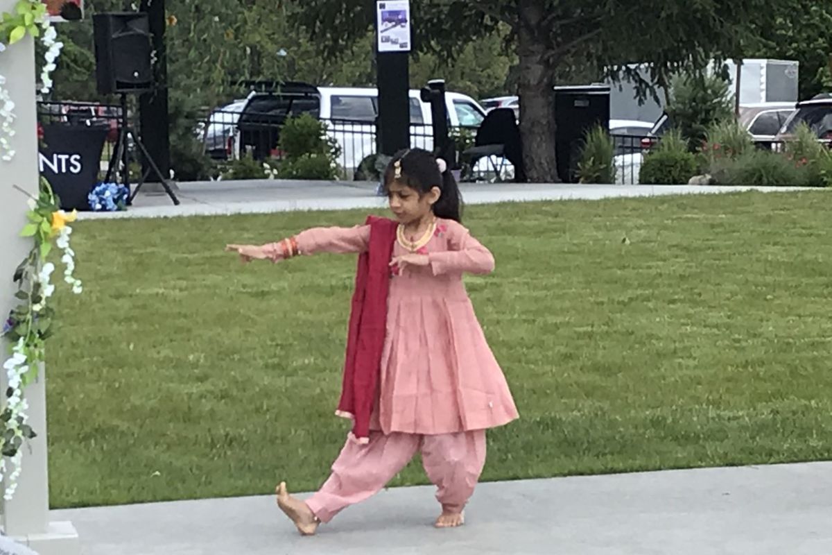 Six-year-old Asmi Jain from the Natanam School of Bharatanatyam performs the Bharatanatyam Alarippu Saturday in Spokane Valley.  (Nina Culver for The Spokesman-Review)