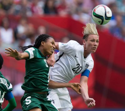 Nigeria's Onome Ebi, left, and United States forward Abby Wambach vie for the ball on Tuesday. (Associated Press)