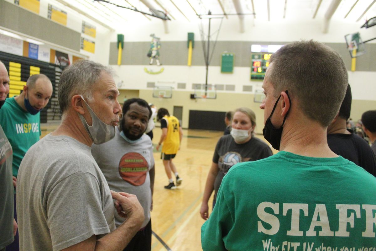 Shadle Park High School teachers including Scott Harmon (left) and Robert Archer (right) huddle during the Staff vs Student Basketball Game on Monday December 6, 2021. Jordan Tolley-Turner/The Spokesman-Review.  (Jordan Tolley-Turner/The Spokesman-Review)