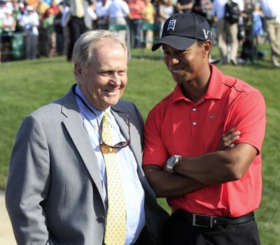 In this June 3, 2012 photo, Jack Nicklaus, left, talks with Tiger Woods after Woods won the Memorial golf tournament at the Muirfield Village Golf Club in Dublin, Ohio. (Associated Press)