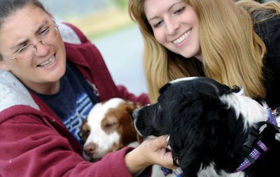 Kathy Armstrong, right, of English Springer Rescue along with Heather Fall, foster dog mom, will participate in Yappy Hour to Benefit Springer Spaniel Rescue at Capone’s Pub and Grill in Post Falls on Tuesday.  (Kathy Plonka / The Spokesman-Review)