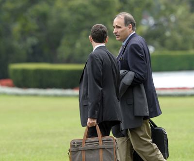 Obama advisers David Plouffe, left, and David Axelrod, right, talk as they walk to Marine One on the South Lawn of the White House in Washington, Wednesday, Sept. 5, 2012. They are traveling with President Barack Obama to Charlotte, N.C., for the Democratic National Convention. (Susan Walsh / Associated Press)