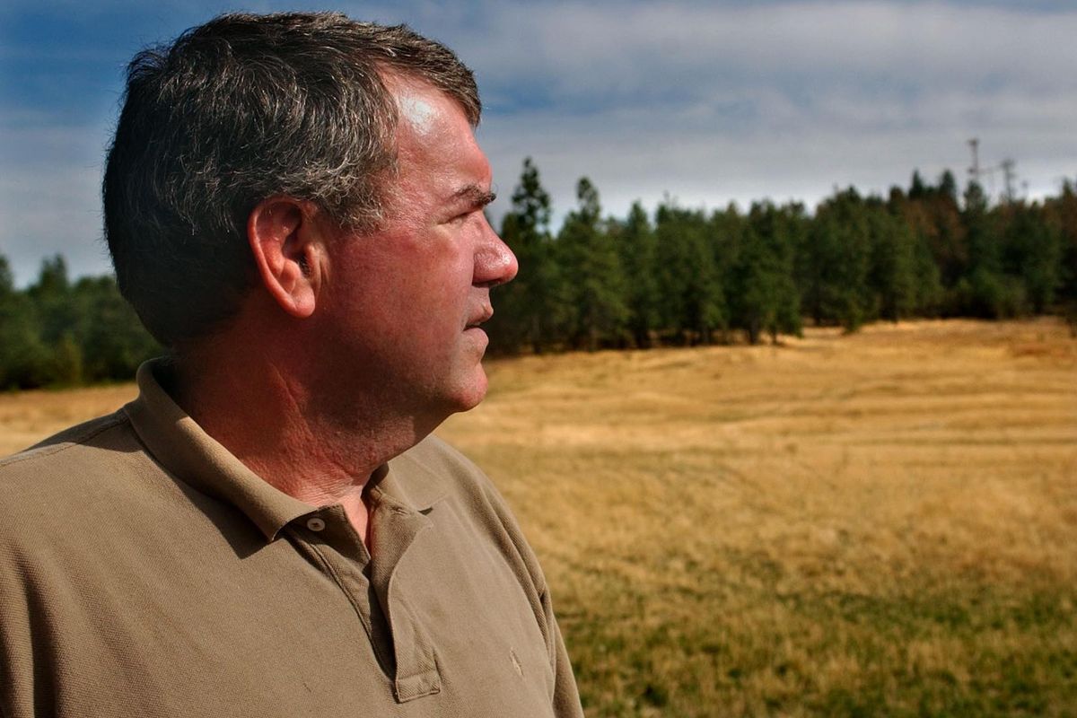 FILE – Pete Rayner looks out over his property off Valley Springs Rd. where he runs the Beacon Hill Event Facility catering to banquets, parties and weddings in this 2002 photo. Rayner is moving forward with his plans to develop the property into a housing subdivision, and is asking the city to extend water service that he says would help get a school and other amenities built on surrounding land. (ROBERT J SHAER / SR)