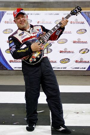 Todd Bodine poses with the Sam Bass designed Wes Paul Gibson guitar trophy in victory lane at Nashville Superspeedway. (Photo courtesy of Jason Smith/Getty Images for NASCAR) (Jason Smith / Getty Images North America)