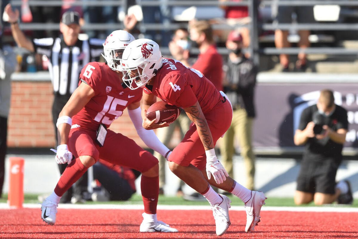 Washington State Cougars quarterback Jayden de Laura (4) celebrates with wide receiver Mitchell Quinn (15) after he scored a touchdown against the Portland State Vikings during the first half of a college football game on Saturday, Sep 11, 2021, at Martin Stadium in Pullman, Wash.  (Tyler Tjomsland/The Spokesman-Review)