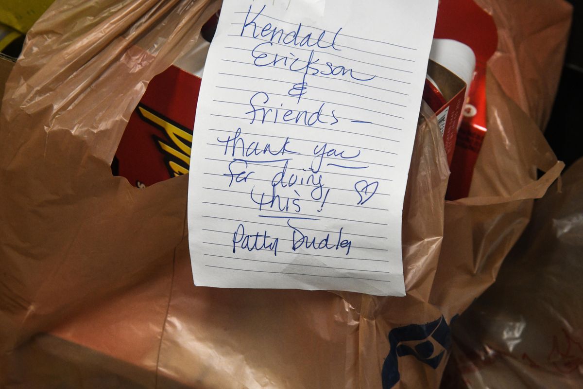 A note thanking Bite2Go organizer and Salk Middle School math teacher, Kendall Erickson is attached to donated a bag of donated food, Wednesday, April 1, 2020. (Dan Pelle / The Spokesman-Review)