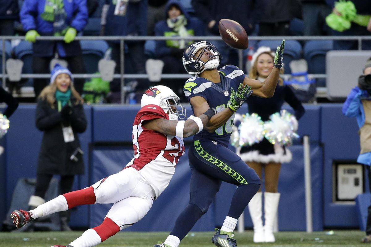 Seattle’s Tyler Lockett, right, was limited to 41 receptions last season because of injury. (Ted S. Warren / Associated Press)